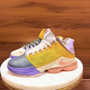 Nike LeBron 19 Low 'Mismatch' basketball shoes featuring a lilac, pink gaze, and dark smoke grey colorway